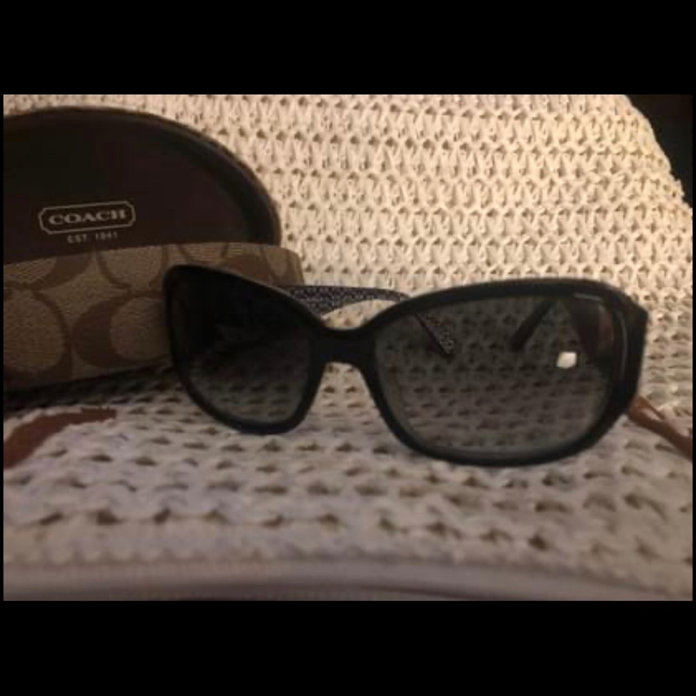 Coach sunglasses with Coach script written on side
